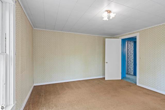 12570 N Cathead Point Rd, Northport, MI 49670 - carpeted empty room with wallpapered walls and crown molding