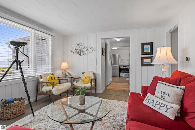 5896 S Cummings St, Suttons Bay, MI 49682 - living area with healthy amount of natural light, wood finished floors, and baseboards
