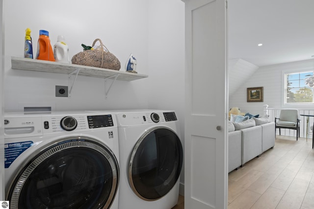 5896 S Cummings St, Suttons Bay, MI 49682 - washroom featuring washer and clothes dryer, light wood finished floors, and recessed lighting