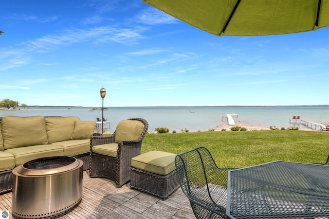 5896 S Cummings St, Suttons Bay, MI 49682 - view of patio / terrace featuring outdoor lounge area and a water view