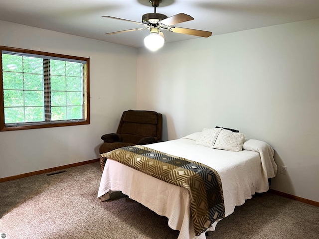 1619 E Gaylord St Unit A, Mount Pleasant, MI 48858 - carpeted bedroom with baseboards and a ceiling fan
