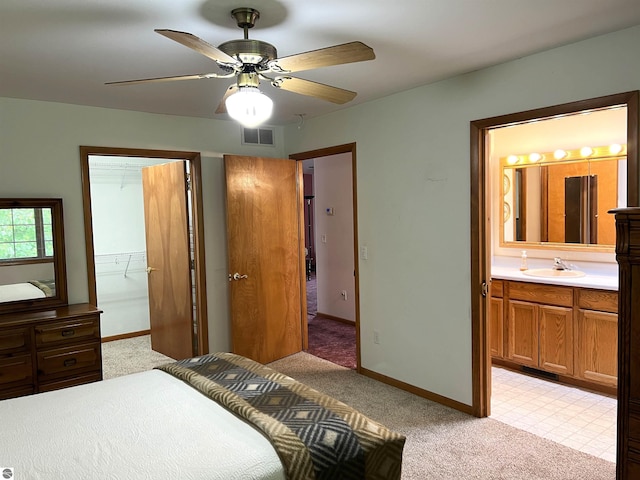 1619 E Gaylord St Unit A, Mount Pleasant, MI 48858 - bedroom featuring light carpet, a sink, and ensuite bathroom