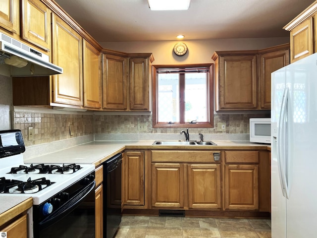 1619 E Gaylord St Unit A, Mount Pleasant, MI 48858 - kitchen with white appliances, exhaust hood, a sink, brown cabinets, and light countertops