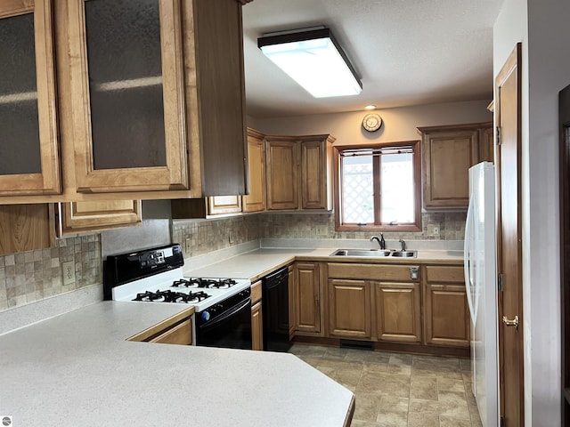 1619 E Gaylord St Unit A, Mount Pleasant, MI 48858 - kitchen with gas range oven, black dishwasher, a sink, and light countertops
