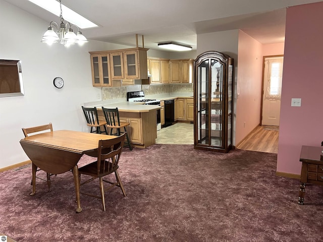 1619 E Gaylord St Unit A, Mount Pleasant, MI 48858 - dining space with carpet, a chandelier, baseboards, and vaulted ceiling