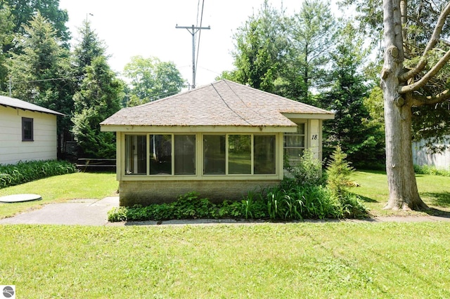 1650 N Huron, Tawas City, MI 48763 - exterior space featuring a lawn
