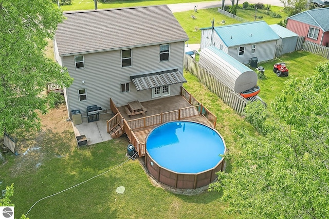 4074 Filter Rd, Harrison, MI 48625 - rear view of house featuring a deck and roof with shingles
