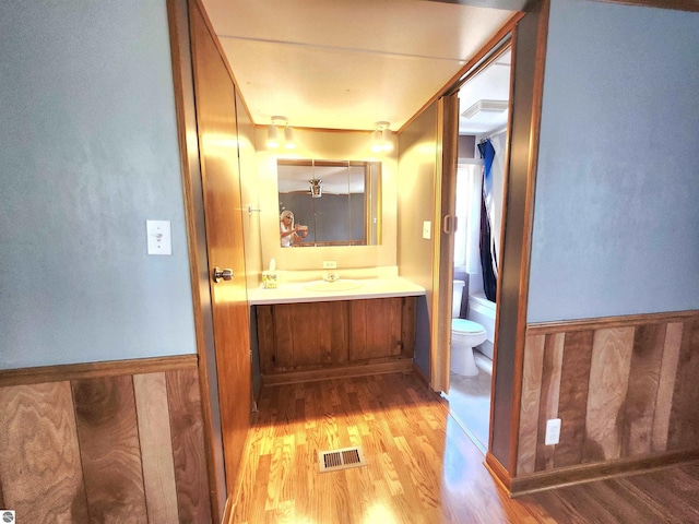 3764 E N Down River Rd, Grayling, MI 49738 - bathroom featuring wood finished floors, vanity, and toilet