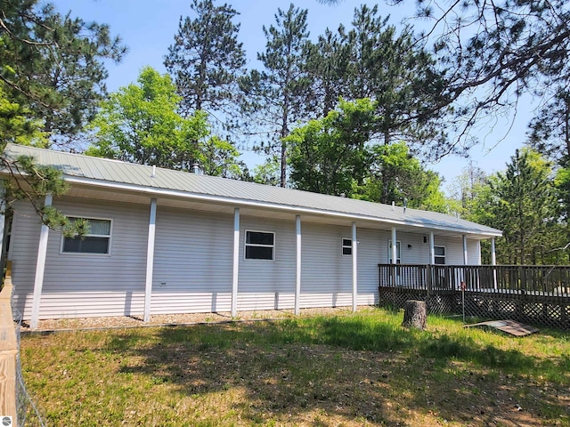 3764 E N Down River Rd, Grayling, MI 49738 - back of house featuring metal roof and a wooden deck