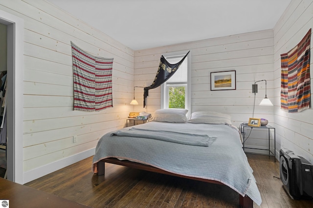 3362 S French Rd, Cedar, MI 49621 - bedroom featuring wooden walls and hardwood / wood-style flooring