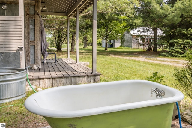 3362 S French Rd, Cedar, MI 49621 - full bath with a freestanding tub and vaulted ceiling