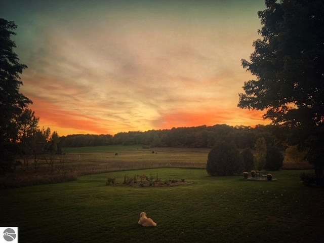 3362 S French Rd, Cedar, MI 49621 - yard at dusk featuring a yard and a view of countryside