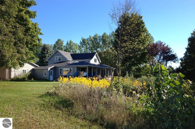 3362 S French Rd, Cedar, MI 49621 - view of property exterior featuring a yard