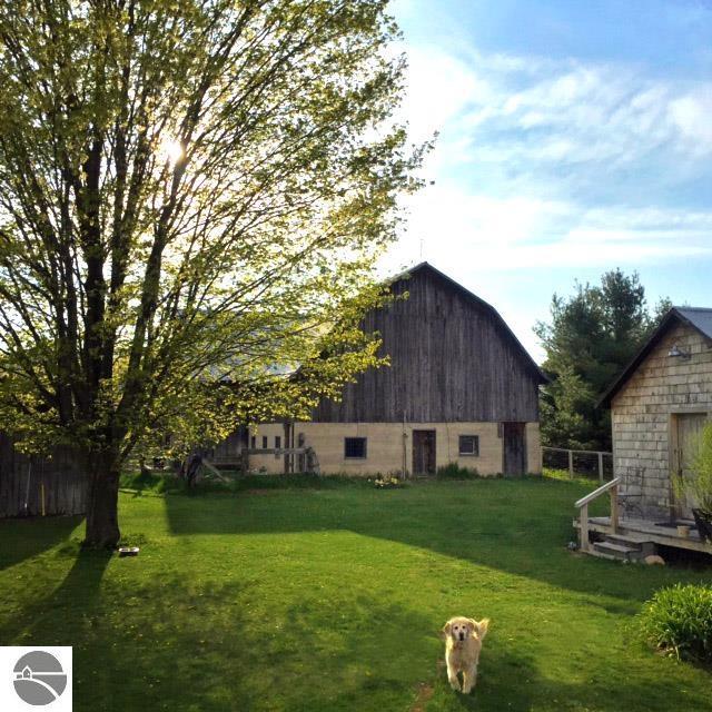 3362 S French Rd, Cedar, MI 49621 - view of yard featuring a barn and an outdoor structure