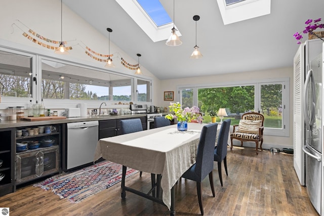 3362 S French Rd, Cedar, MI 49621 - dining space with a skylight, high vaulted ceiling, and dark wood-style flooring