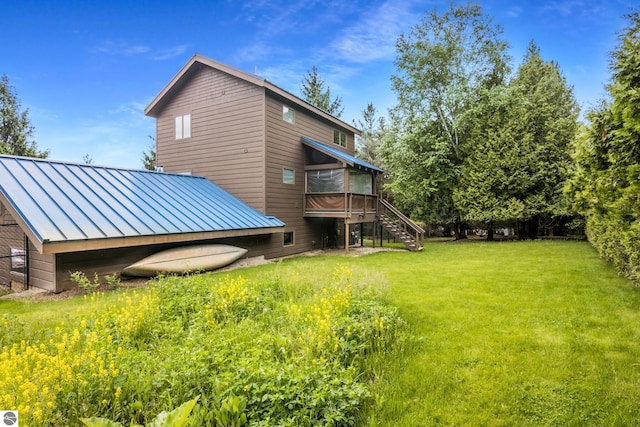 110 W Terrace Lane Commons, Leland, MI 49654 - view of green lawn with stairs and a wooden deck