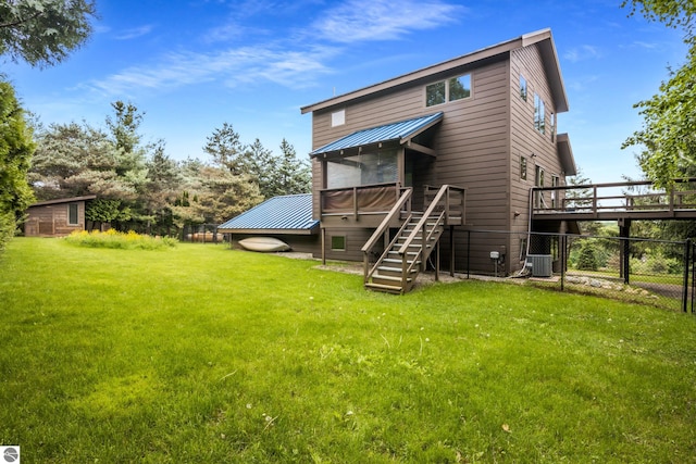 110 W Terrace Lane Commons, Leland, MI 49654 - rear view of property featuring a wooden deck, central AC, metal roof, and stairway