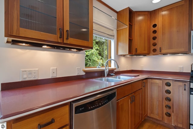 110 W Terrace Lane Commons, Leland, MI 49654 - kitchen with dishwasher, a sink, and brown cabinetry