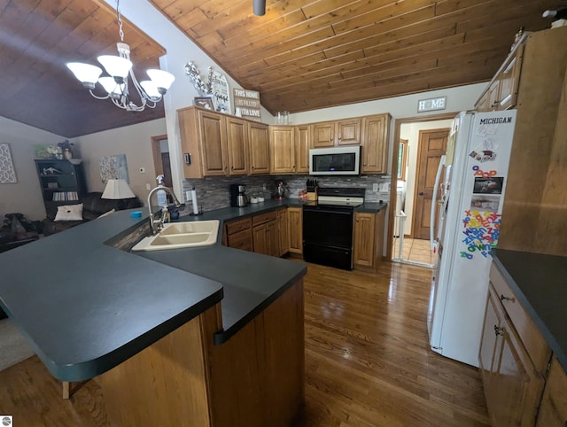 8544 Esmond Rd, Hale, MI 48739 - kitchen featuring black / electric stove, white refrigerator with ice dispenser, dark countertops, vaulted ceiling, and dark wood-style flooring