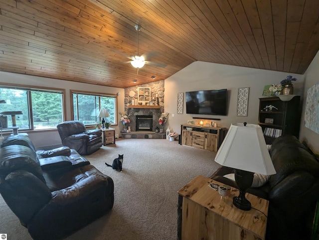 8544 Esmond Rd, Hale, MI 48739 - living area with lofted ceiling, carpet flooring, ceiling fan, wood ceiling, and a stone fireplace