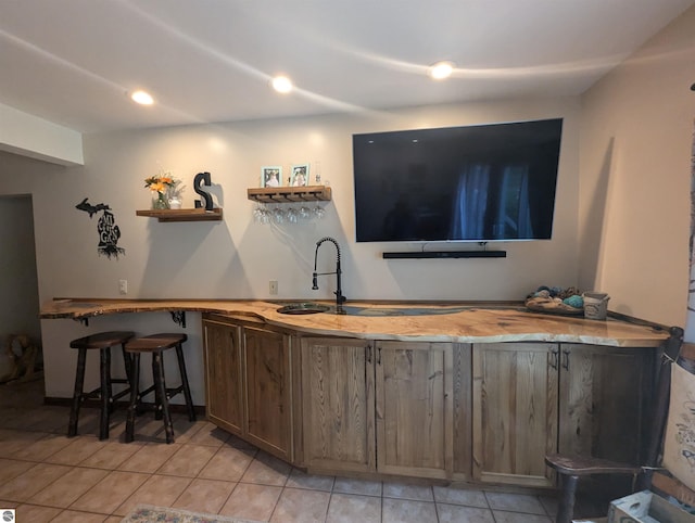 8544 Esmond Rd, Hale, MI 48739 - indoor wet bar featuring light tile patterned floors and recessed lighting
