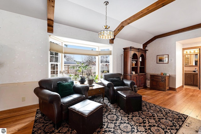 739 Stimson St, Cadillac, MI 49601 - living area with light wood-style floors and a chandelier