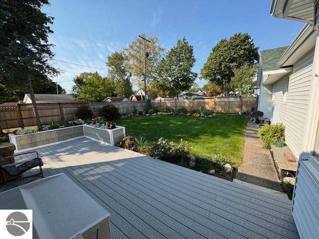 739 Stimson St, Cadillac, MI 49601 - wooden terrace with grilling area