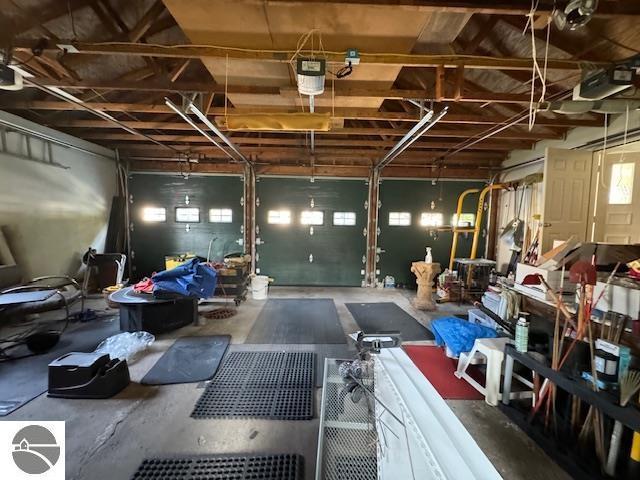 739 Stimson St, Cadillac, MI 49601 - garage featuring a garage door opener