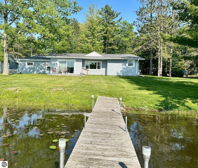 3732 E Cedar Lake Dr, Greenbush, MI 48738 - dock featuring a lawn and a water view