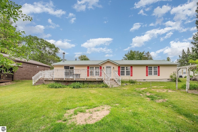 5489 W Lake Shore Dr, Weidman, MI 48893 - back of house with a wooden deck, a yard, crawl space, and a metal roof