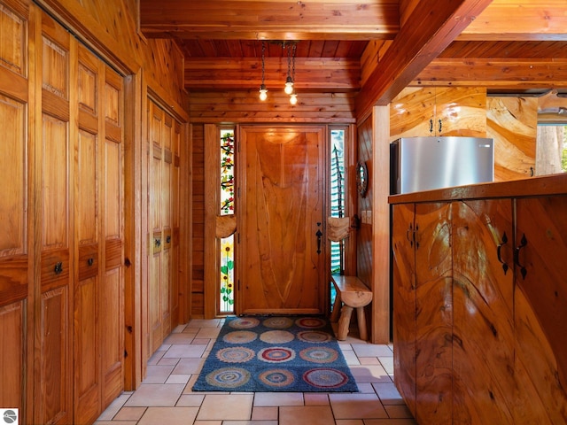 10037 Mud Lake Rd, Interlochen, MI 49643 - foyer with wooden walls and a wood ceiling with exposed beams