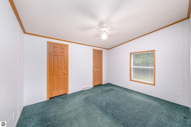 19275 Coates Hwy, Brethren, MI 49619 - unfurnished bedroom featuring lofted ceiling, carpet, a textured ceiling, ornamental molding, and ceiling fan