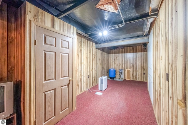 19275 Coates Hwy, Brethren, MI 49619 - finished below grade area with wooden walls, a water pressure tank, and carpet