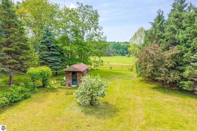 19275 Coates Hwy, Brethren, MI 49619 - view of green lawn with an outbuilding