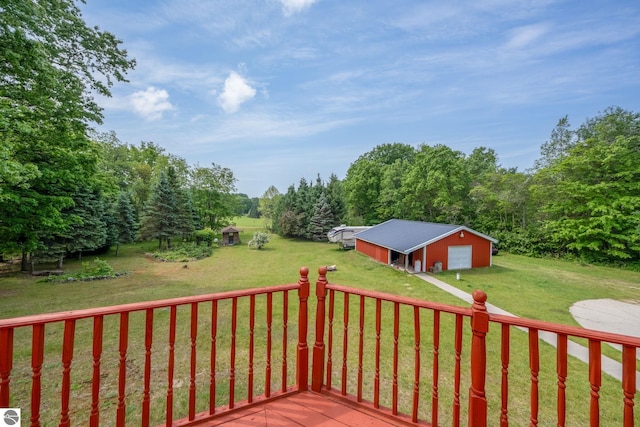 19275 Coates Hwy, Brethren, MI 49619 - deck featuring a garage, an outbuilding, a yard, and a pole building