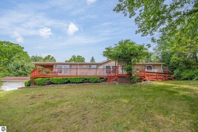 19275 Coates Hwy, Brethren, MI 49619 - rear view of house featuring a deck and a yard