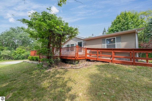19275 Coates Hwy, Brethren, MI 49619 - rear view of property with a yard and a wooden deck
