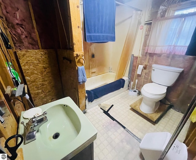 1415 Paczesny Pl, Central Lake, MI 49622 - full bathroom featuring tile patterned floors, shower / tub combo with curtain, and vanity