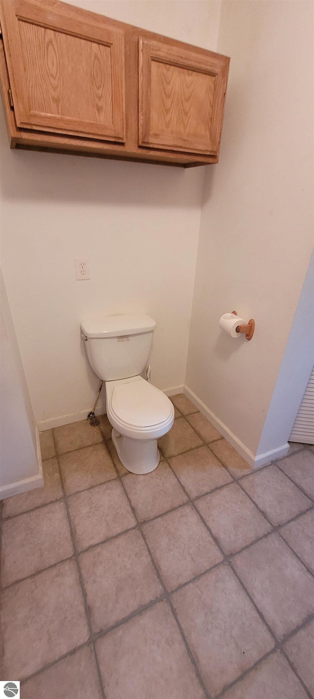 601 Monroe, Mancelona, MI 49659 - bathroom with toilet and tile patterned flooring