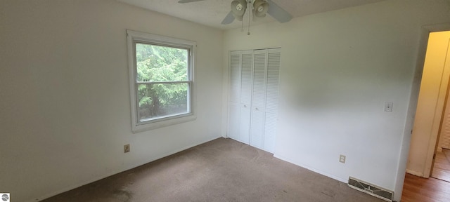 601 Monroe, Mancelona, MI 49659 - unfurnished bedroom featuring a closet and a ceiling fan