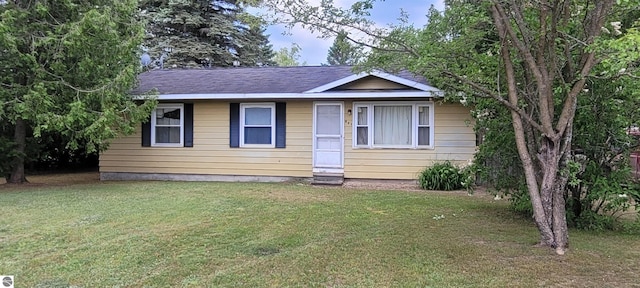 601 Monroe, Mancelona, MI 49659 - view of front of home with a front yard and entry steps