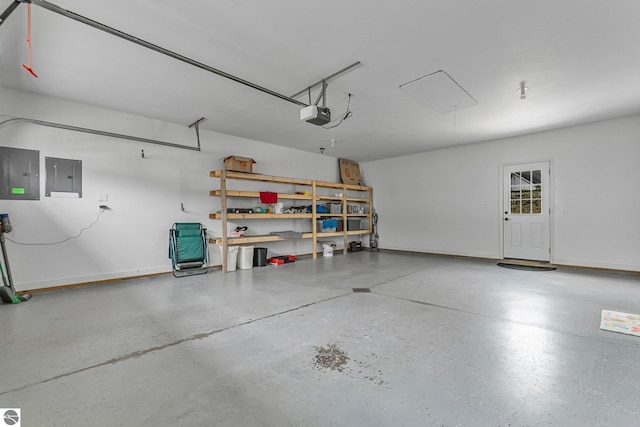 3872 Falling Leaf Trl, Traverse City, MI 49686 - garage featuring electric panel and a garage door opener