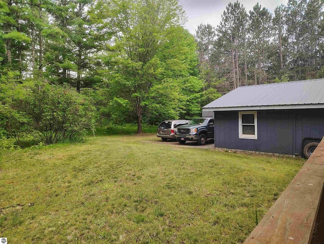 5094 SW Old Butler Rd Unit 1, South Boardman, MI 49680 - view of grassy yard featuring a view of trees