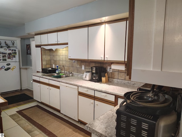 5094 SW Old Butler Rd Unit 1, South Boardman, MI 49680 - kitchen with white appliances, white cabinetry, light countertops, and tasteful backsplash