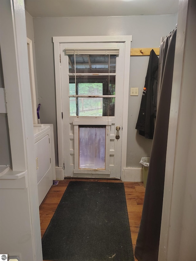 5094 SW Old Butler Rd Unit 1, South Boardman, MI 49680 - entryway with wood finished floors and washer / clothes dryer