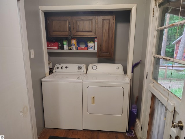 5094 SW Old Butler Rd Unit 1, South Boardman, MI 49680 - washroom with cabinet space, washer and dryer, and wood finished floors