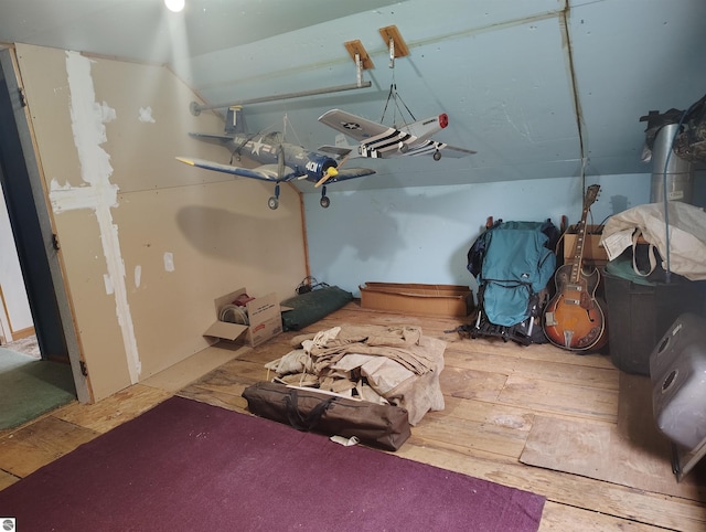5094 SW Old Butler Rd Unit 1, South Boardman, MI 49680 - basement featuring hardwood / wood-style flooring
