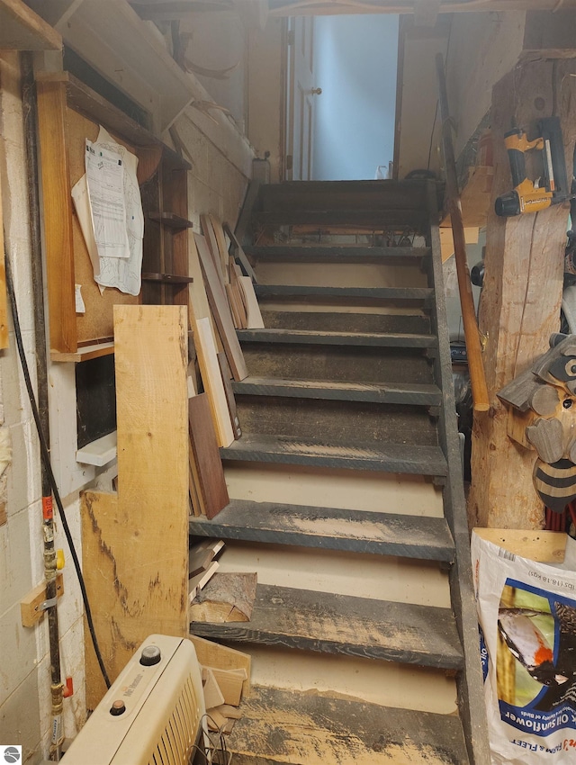 5094 SW Old Butler Rd Unit 1, South Boardman, MI 49680 - stairs featuring concrete block wall