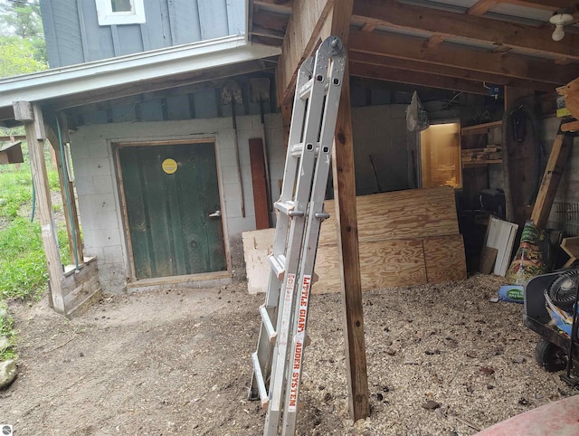 5094 SW Old Butler Rd Unit 1, South Boardman, MI 49680 - doorway to property with concrete block siding
