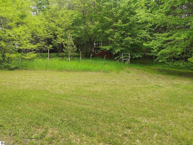 5094 SW Old Butler Rd Unit 1, South Boardman, MI 49680 - view of yard with a view of trees